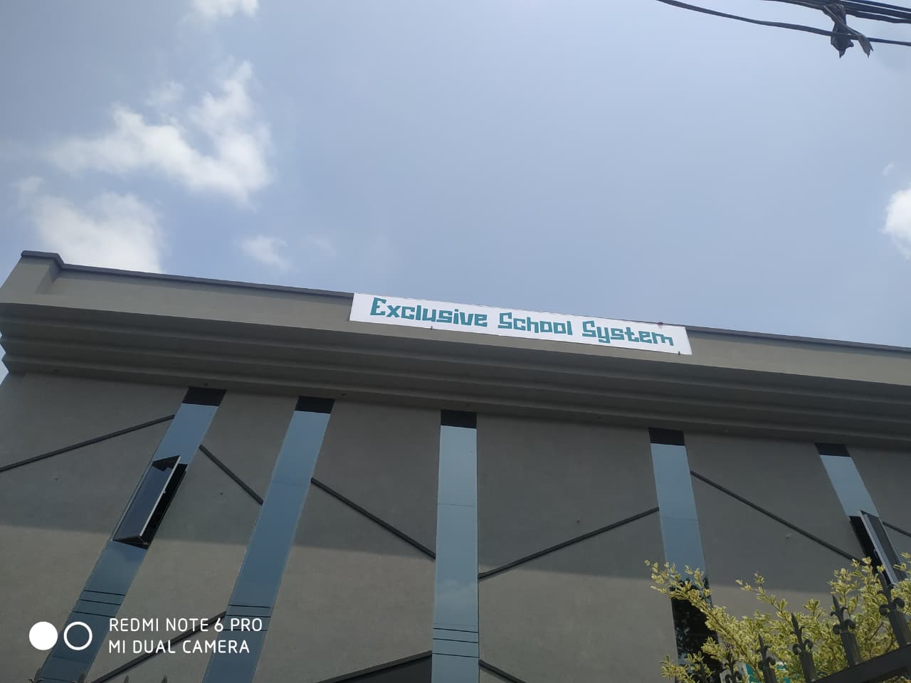 Exclusive School System building — one of the schools shaping our self-paced approach.